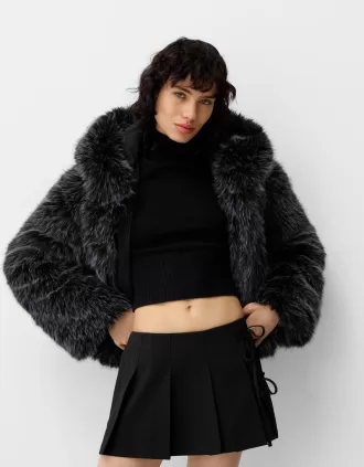 Box pleat mini skirt with bow detail