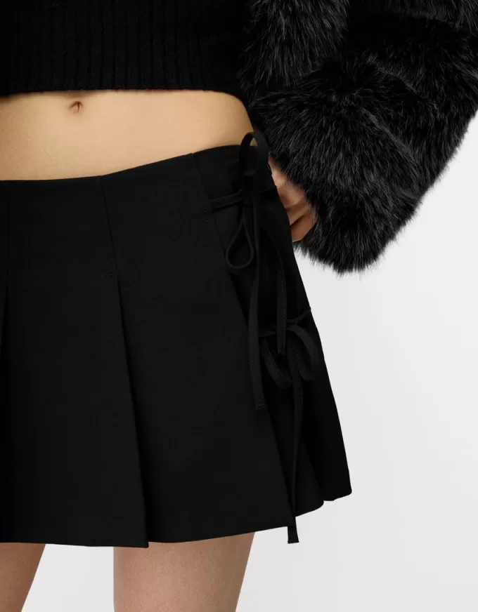 Box pleat mini skirt with bow detail Box pleat mini skirt with bow detail
