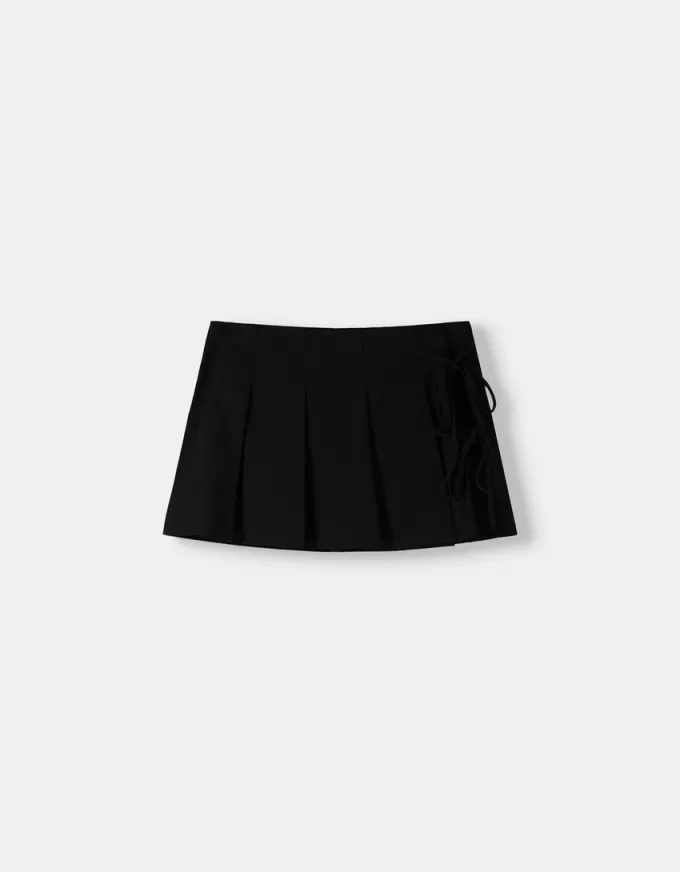 Box pleat mini skirt with bow detail Box pleat mini skirt with bow detail