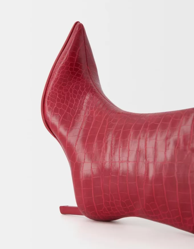 Embossed animal print heeled ankle boots