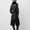 Fitted leather effect jacket with a sweatshirt material neck Fitted leather effect jacket with a sweatshirt material neck