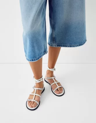 Flat sandals with ring details