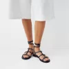 Flat sandals with ring details