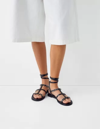 Flat sandals with ring details