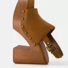 High-heel studded platform clogs High-heel studded platform clogs