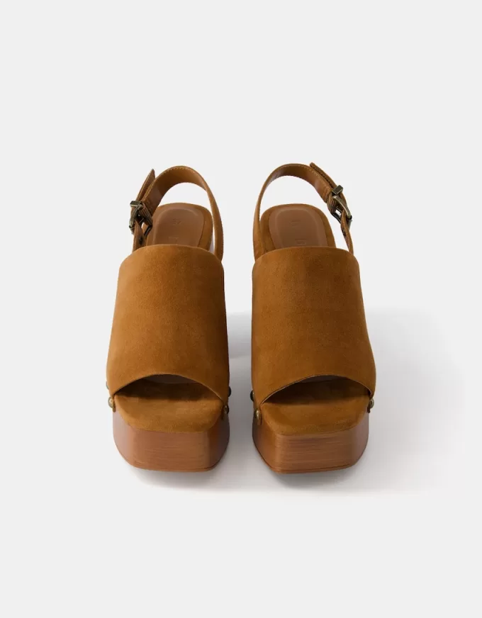 High-heel studded platform clogs High-heel studded platform clogs