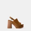 High-heel studded platform clogs High-heel studded platform clogs