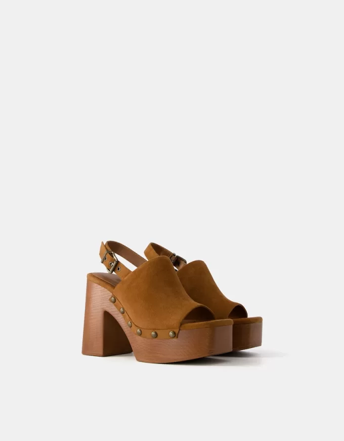 High-heel studded platform clogs High-heel studded platform clogs