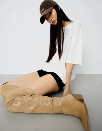 Knee-high high-heel cowboy boots