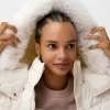 Puffer jacket with faux fur hood