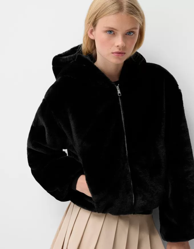 Quilted jacket with faux fur hood Quilted jacket with faux fur hood