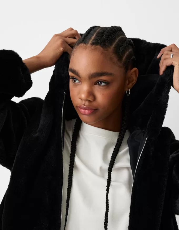 Quilted jacket with faux fur hood