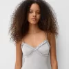 Ruffled bodysuit with straps Ruffled bodysuit with straps