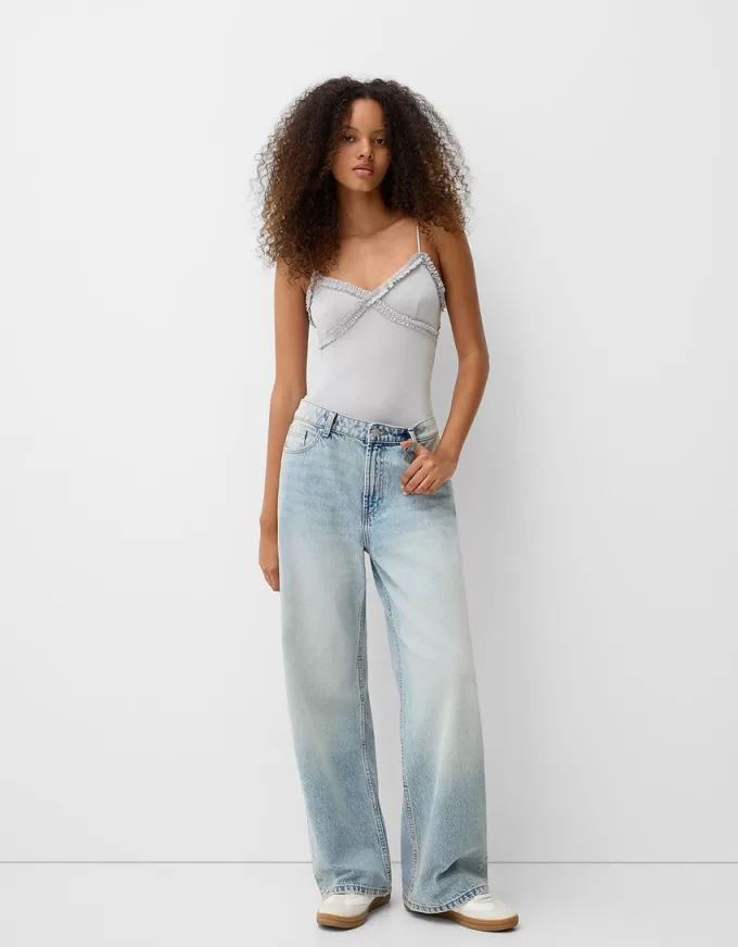 Ruffled bodysuit with straps Ruffled bodysuit with straps