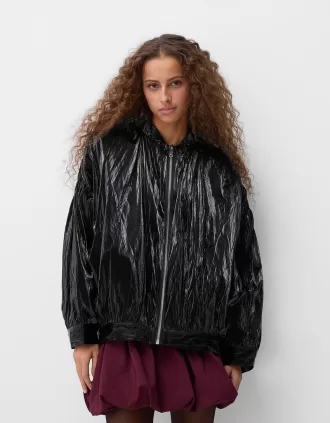 Shiny effect bomber jacket with over print