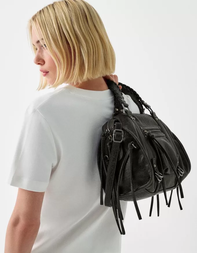 Worn-effect bowling bag with straps